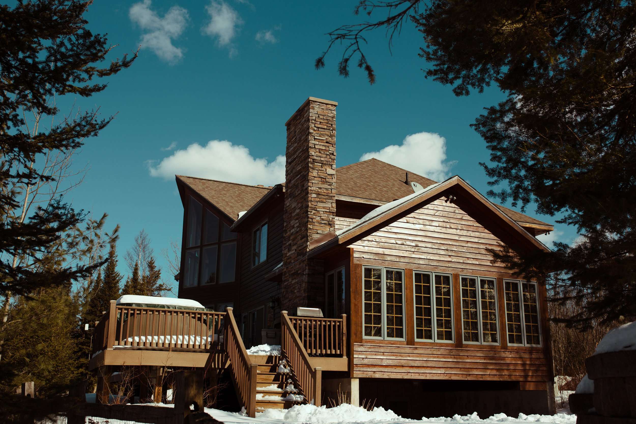 log cabin with snow covered roof