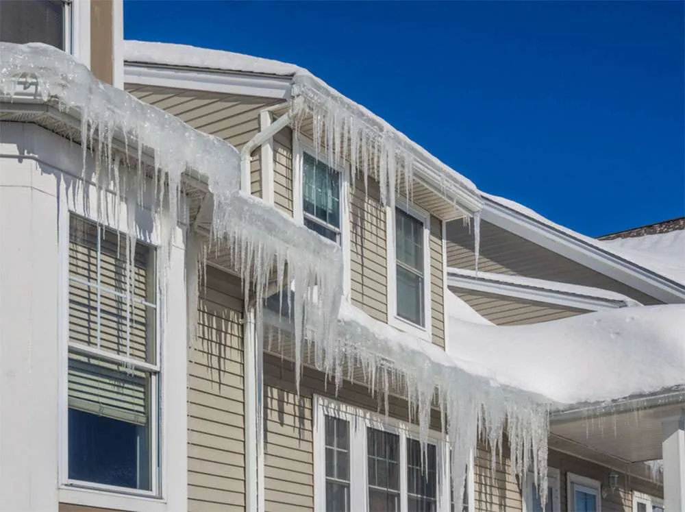 Heavy Ice Dam forming on a roof