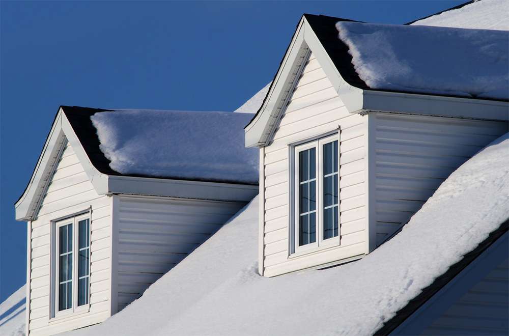 Snow covered roofing | Roof repair