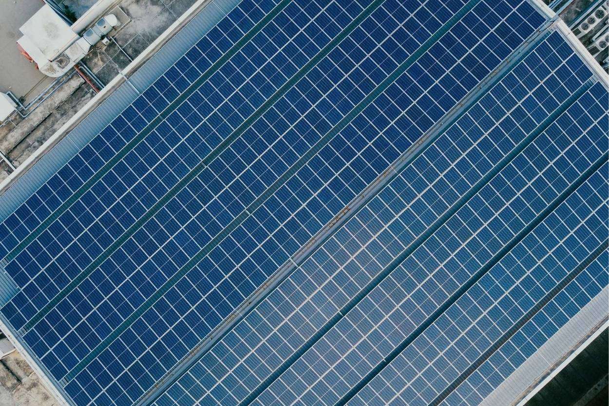 Commercial flat roof covered in solar panels